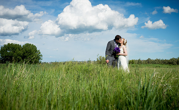 Bride and Groom sharing a moment at the lovely Bow Valley Ranche in Calgary, Alberta, Canada.