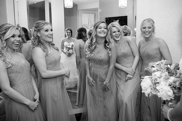 Bridemaids and Bride laugh with each other at the Chapel at Ana Villa in The Colony, Texas.